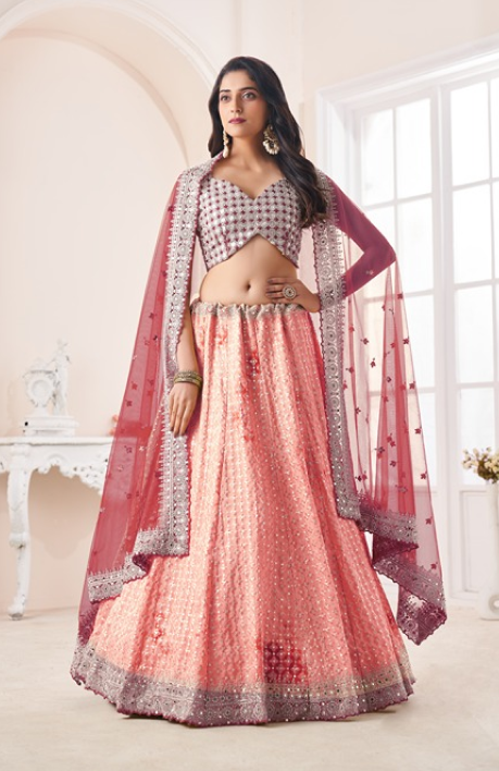 Elegant lehenga model showcasing a pink and red lehenga