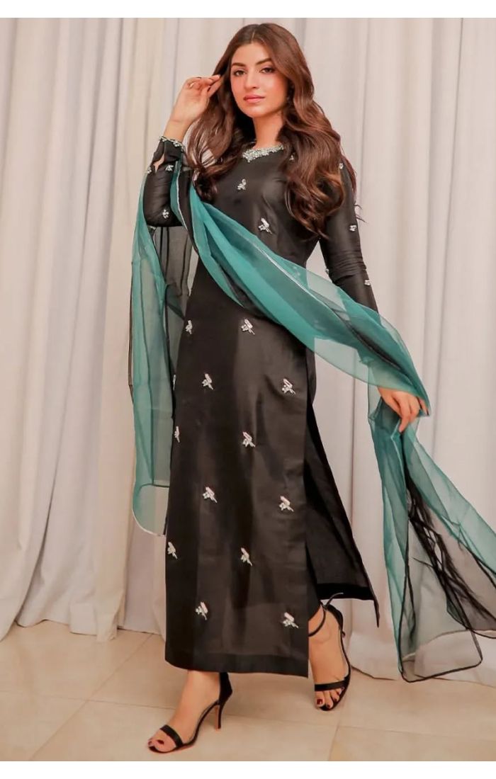 Black embroidered silk suit with emerald green organza dupatta, perfect for Eid, weddings, and festive occasions.