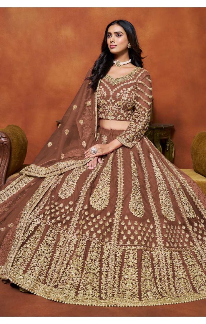 Designer Brown Embroidered Net Lehenga with Golden Choli featuring intricate golden embroidery and luxurious detailing, perfect for weddings and festive celebrations.