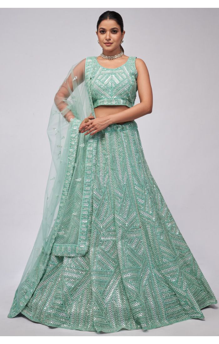 Elegant aqua net partywear lehenga choli with sequin embroidery, sleeveless choli, and matching dupatta for weddings and festive occasions.