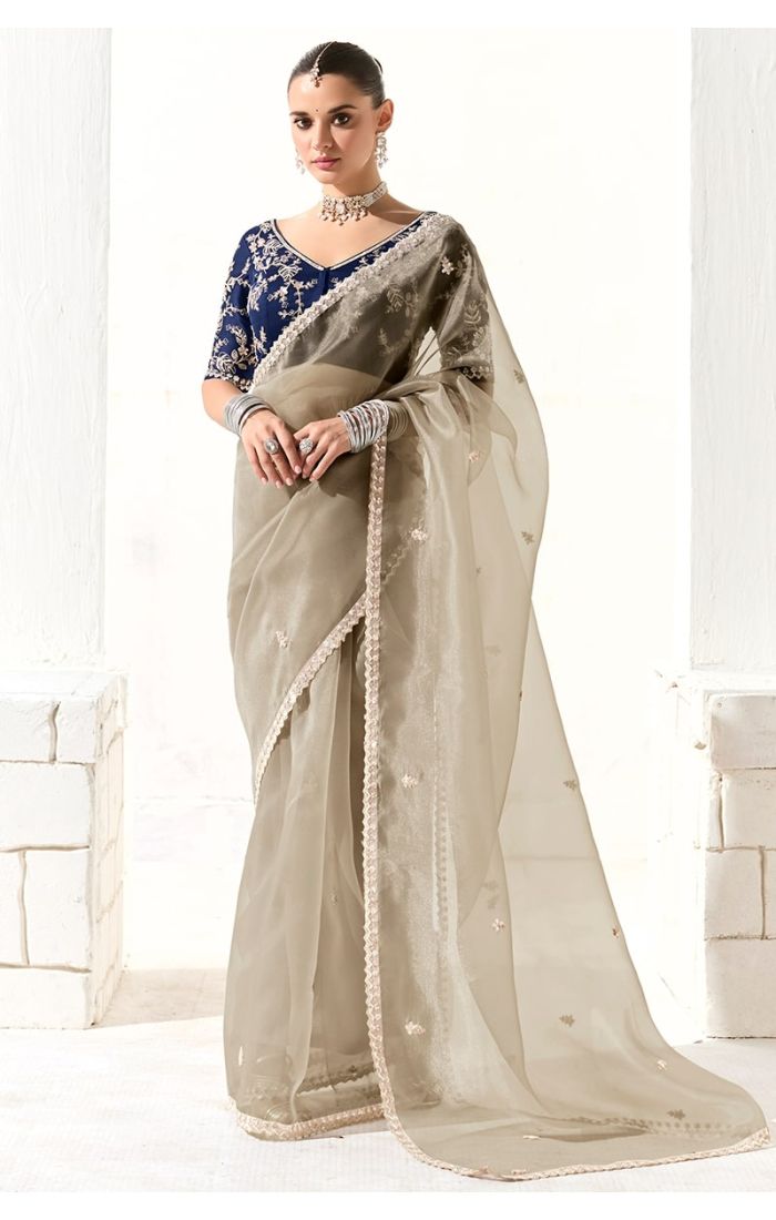Model wearing grey organza silk saree with navy embroidered blouse – front view