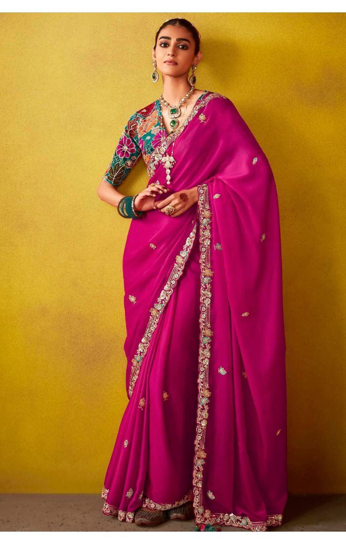 Handcrafted silk saree with zardozi embroidery in fuchsia pink for EID and festive occasions.