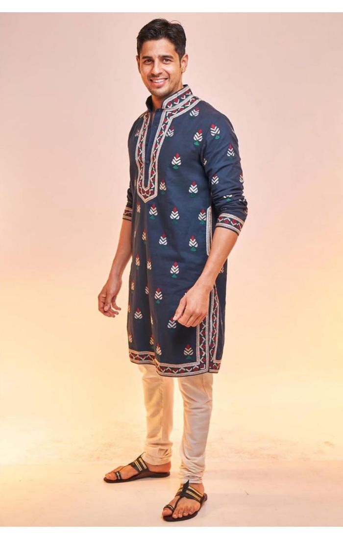 Navy-blue embroidered cotton kurta pajama for men, featuring intricate threadwork on the neckline, cuffs, and hemline. Perfect for weddings and festive occasions.