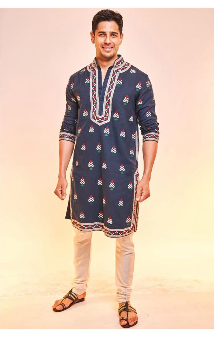 Navy-blue embroidered cotton kurta pajama for men, featuring intricate threadwork on the neckline, cuffs, and hemline. Perfect for weddings and festive occasions.