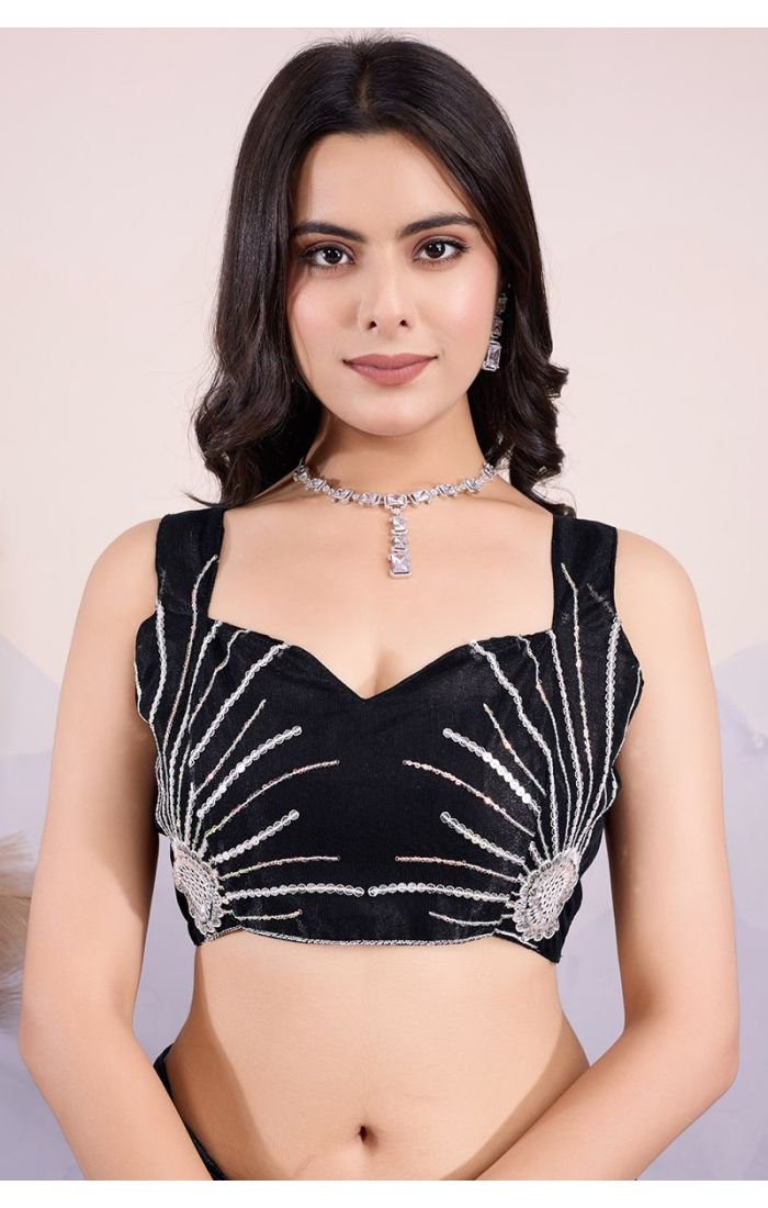 Close-up of intricate sequin and thread embroidery on black twill net saree