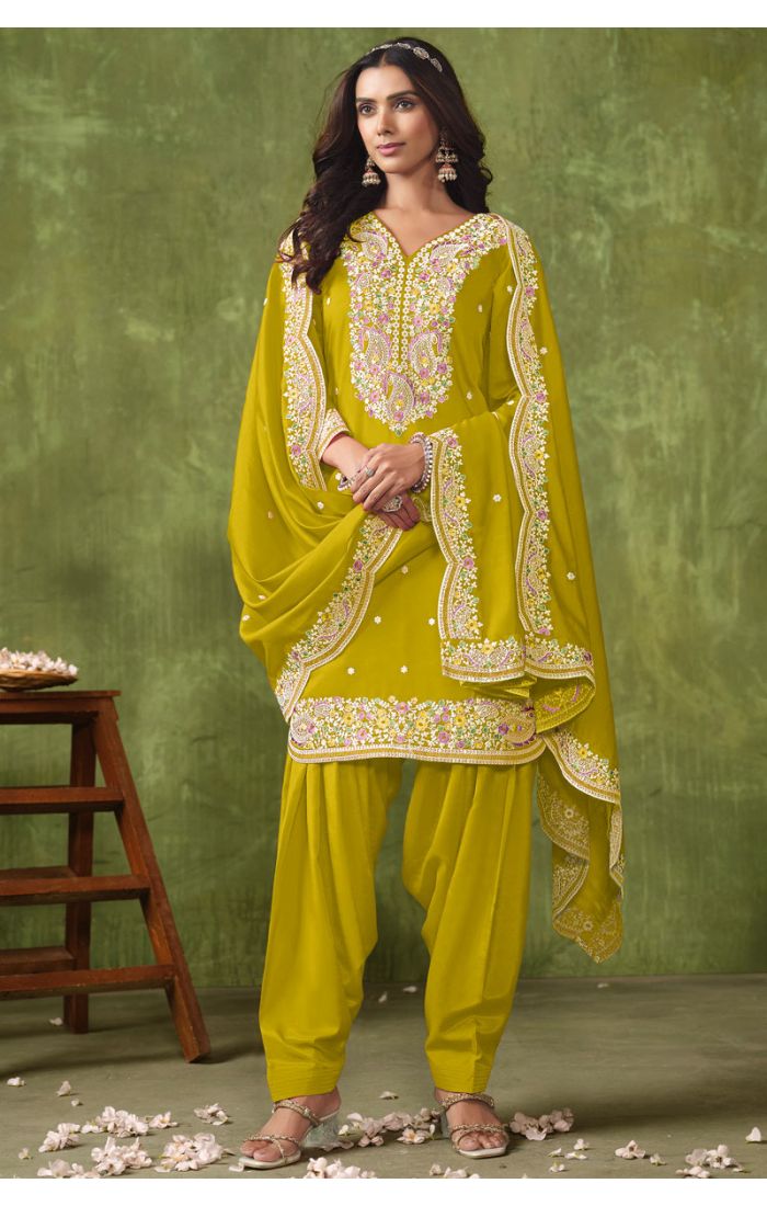 Premium chartreuse yellow georgette salwar suit with multicolour embroidery, matching dupatta, and Patiala pants — perfect for weddings and festive occasions.