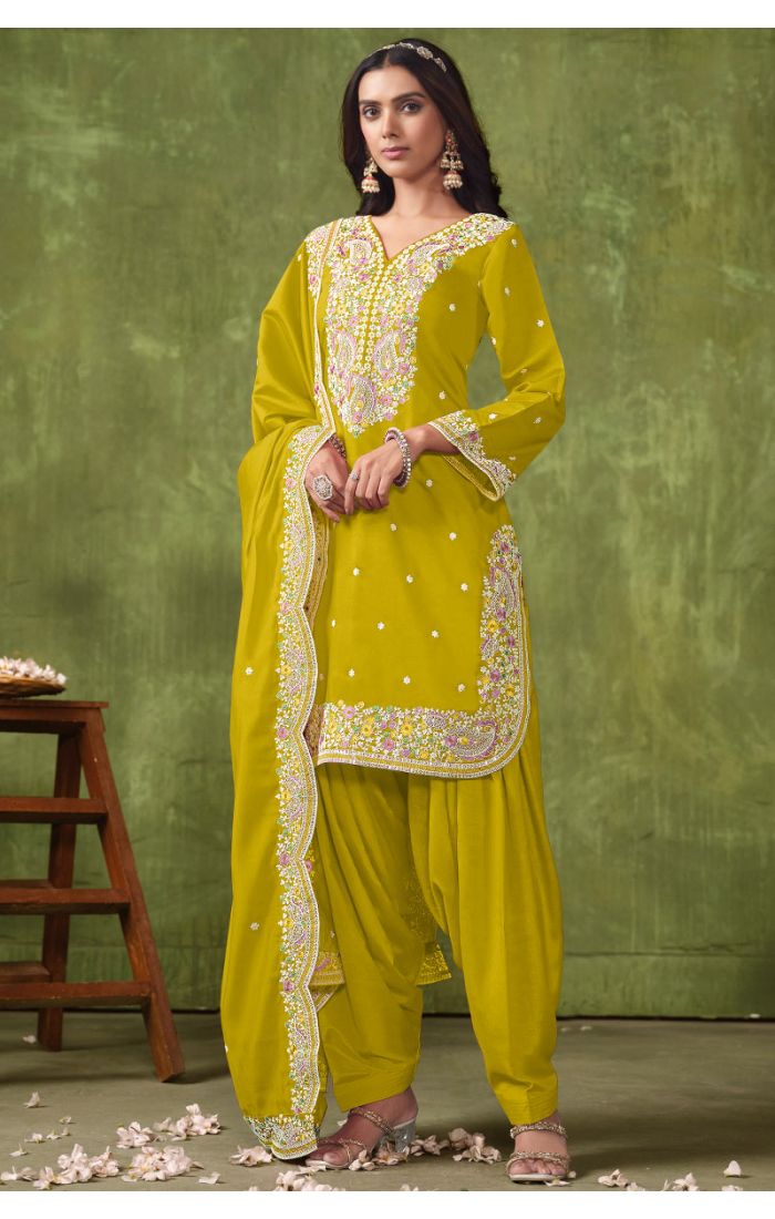 Premium chartreuse yellow georgette salwar suit with multicolour embroidery, matching dupatta, and Patiala pants — perfect for weddings and festive occasions.