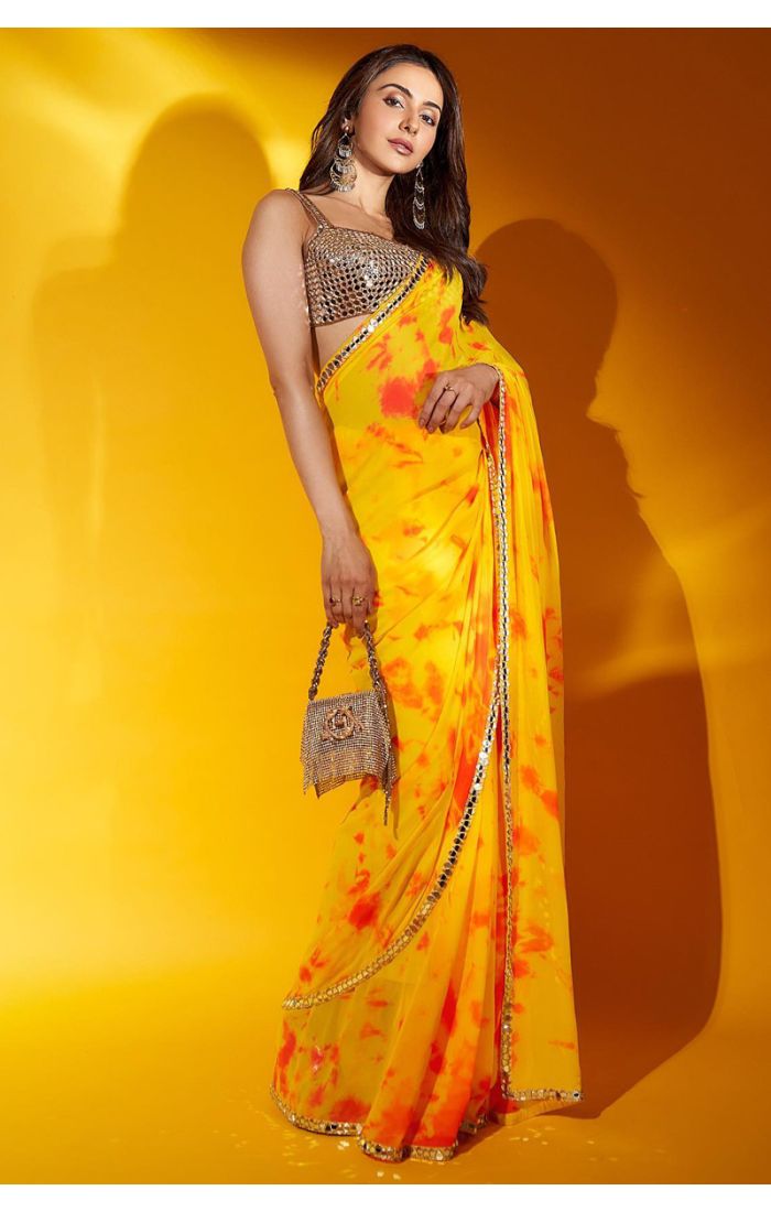 Get Radiant Yellow Mirror Work Tie-Dye Party Saree for Weddings and Festive Occasions in UK and Poland Online 