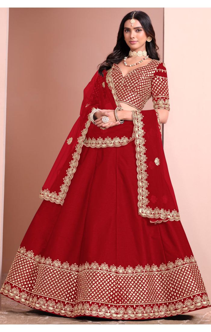 Red bridal lehenga choli with golden embroidery and net dupatta for wedding and festive occasions.