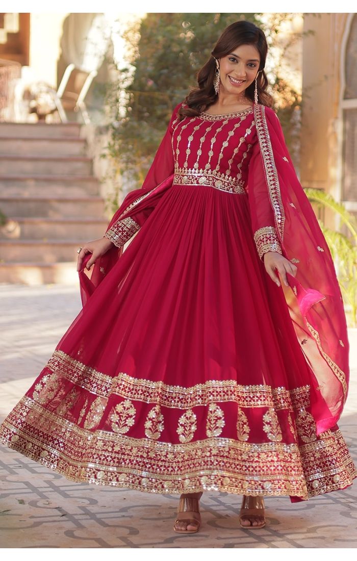  Ruby red Georgette Anarkali suit with golden embroidery, ideal for weddings and festive occasions.