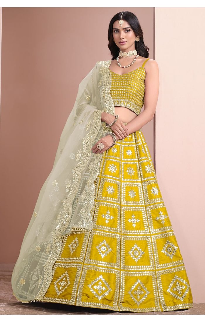 Elegant Yellow Mirror Work Silk Lehenga Choli Set with Net Dupatta - Perfect for Weddings, Festive Celebrations & Special Occasions.