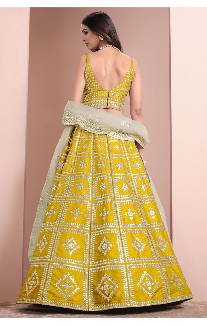 Elegant Yellow Mirror Work Silk Lehenga Choli Set with Net Dupatta - Perfect for Weddings, Festive Celebrations & Special Occasions.