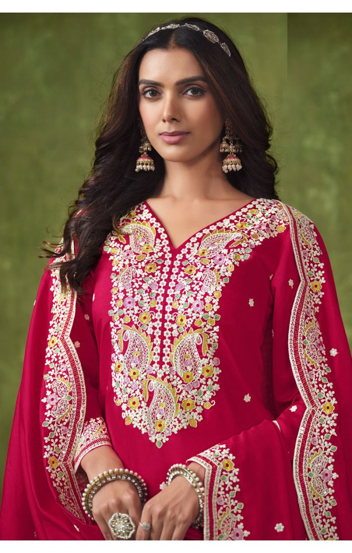 Close-up of rich red embroidered V-neck Punjabi suit for weddings