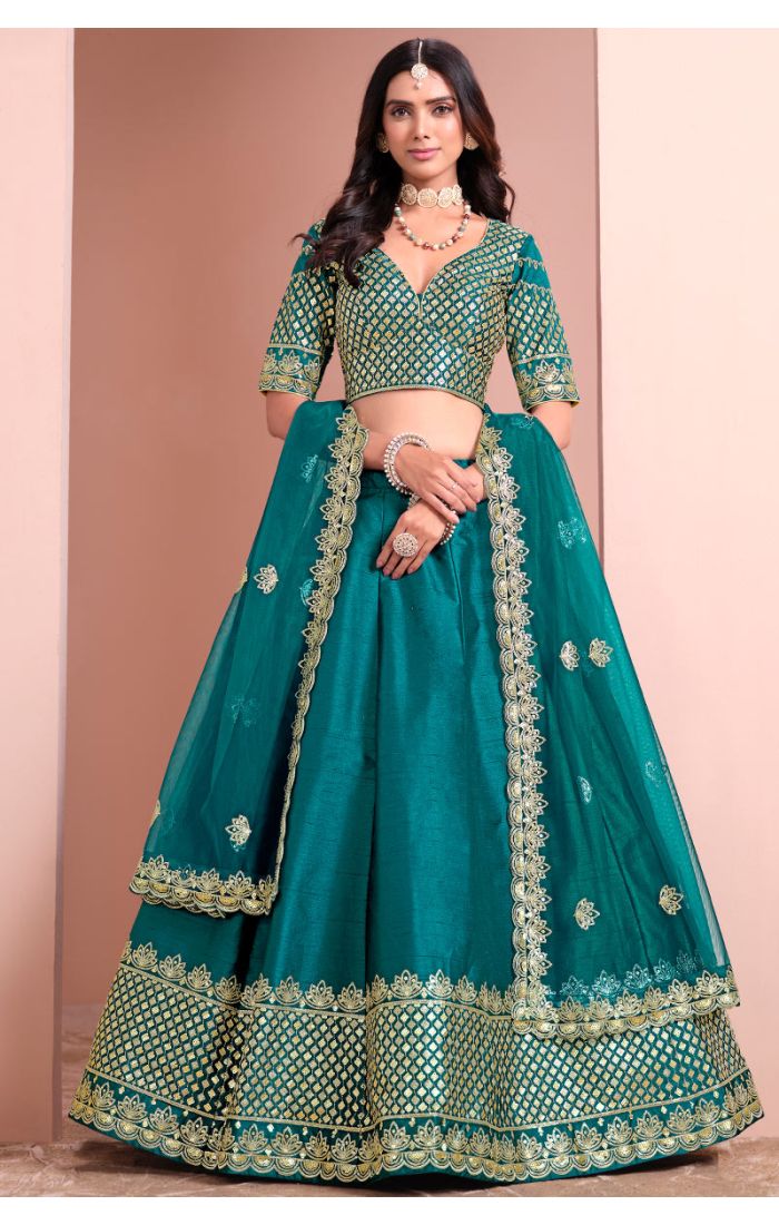 Teal green premium silk satin lehenga choli with zari and sequin embroidery, styled with organza dupatta — Appelle Fashion