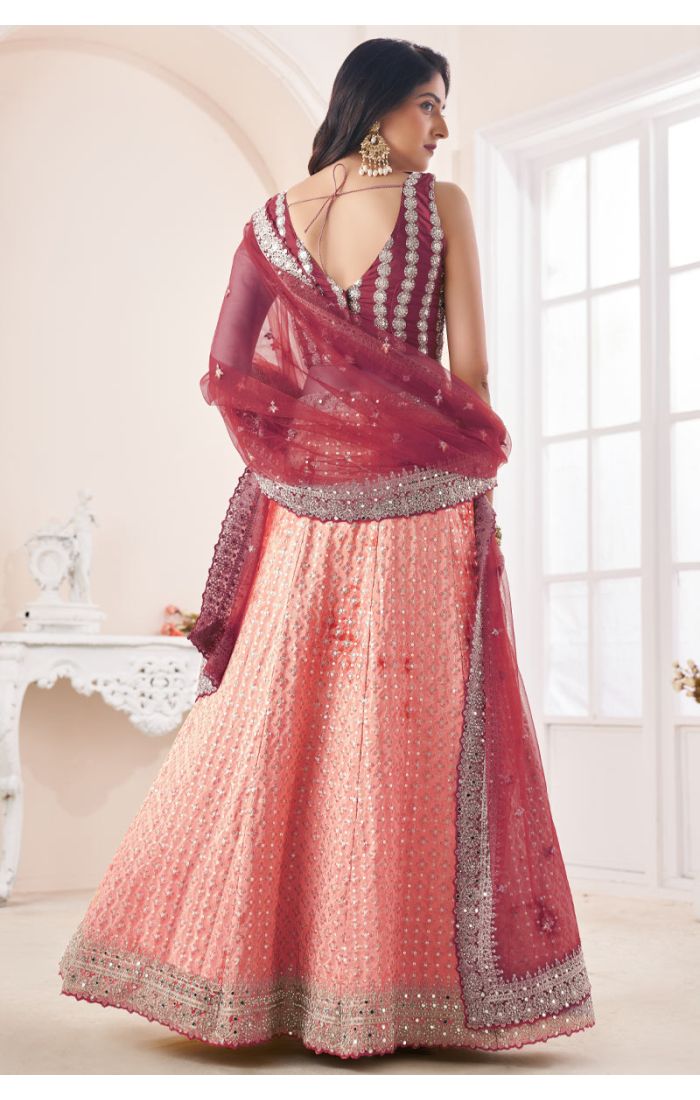 Designer Lehenga Choli with embroidery and dupatta for festive occasions.